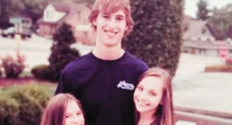 methew gisoni standing outside the house with his stepsisters'