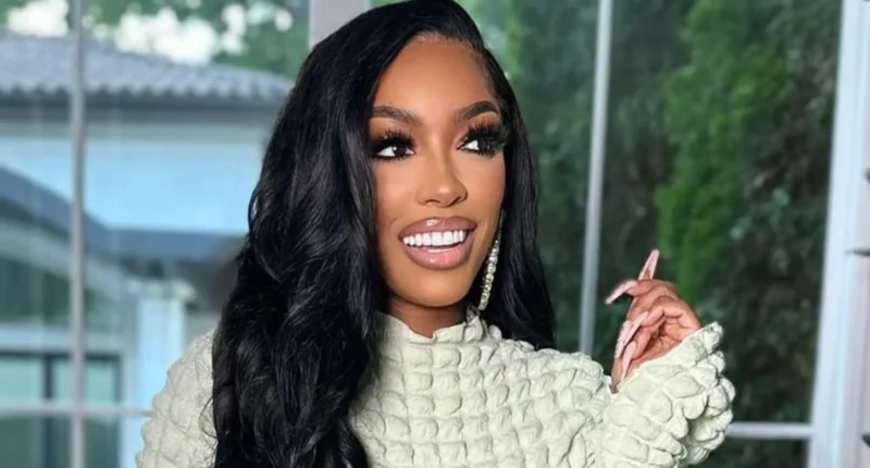 Porsha Williams wearing a stylish white gown, posing confidently.