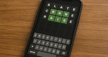 A smartphone screen showing a Wordle game with letter guesses highlighted.