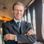 portrait-businessman-with-folded-arms-looking-camera